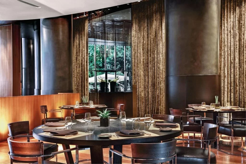 Bulgari Hotel Milan restaurant interior during Milan Design Week showcasing luxury dining and design atmosphere / the Maisons the maisons The Maisons — When Fashion Takes Over the City bulgari milano 1024x683